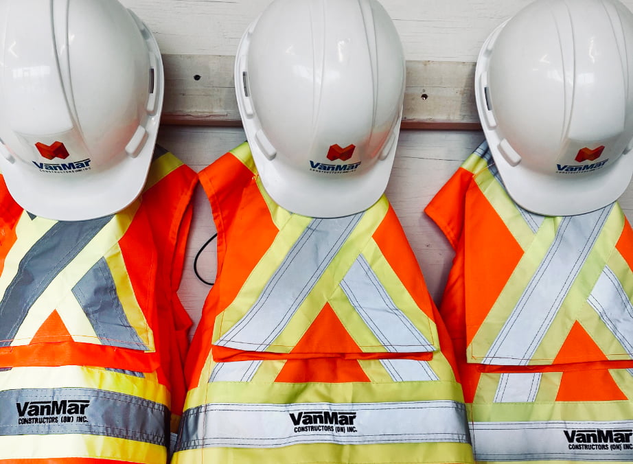 VanMar hard hats hanging with safety vests